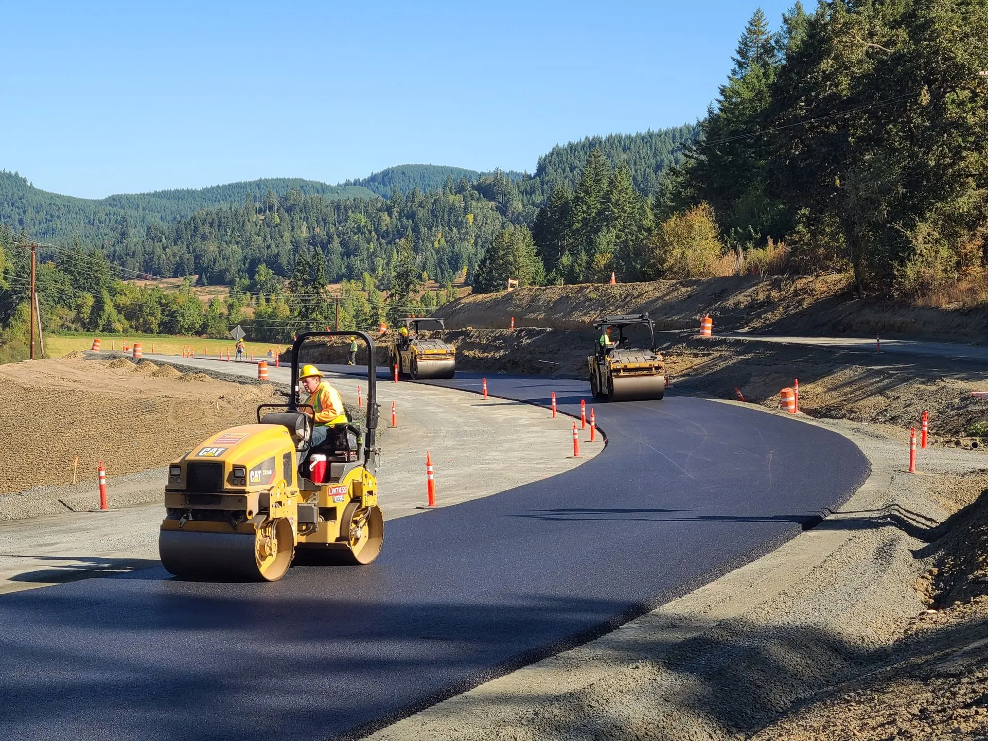 Morello Construction paving operation, crew and rollers on the road